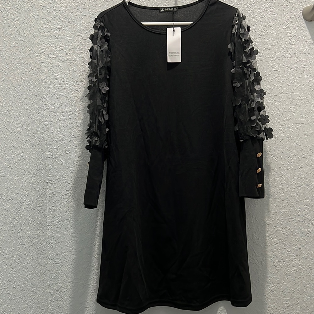 Black dress with sheer sleeves never worn